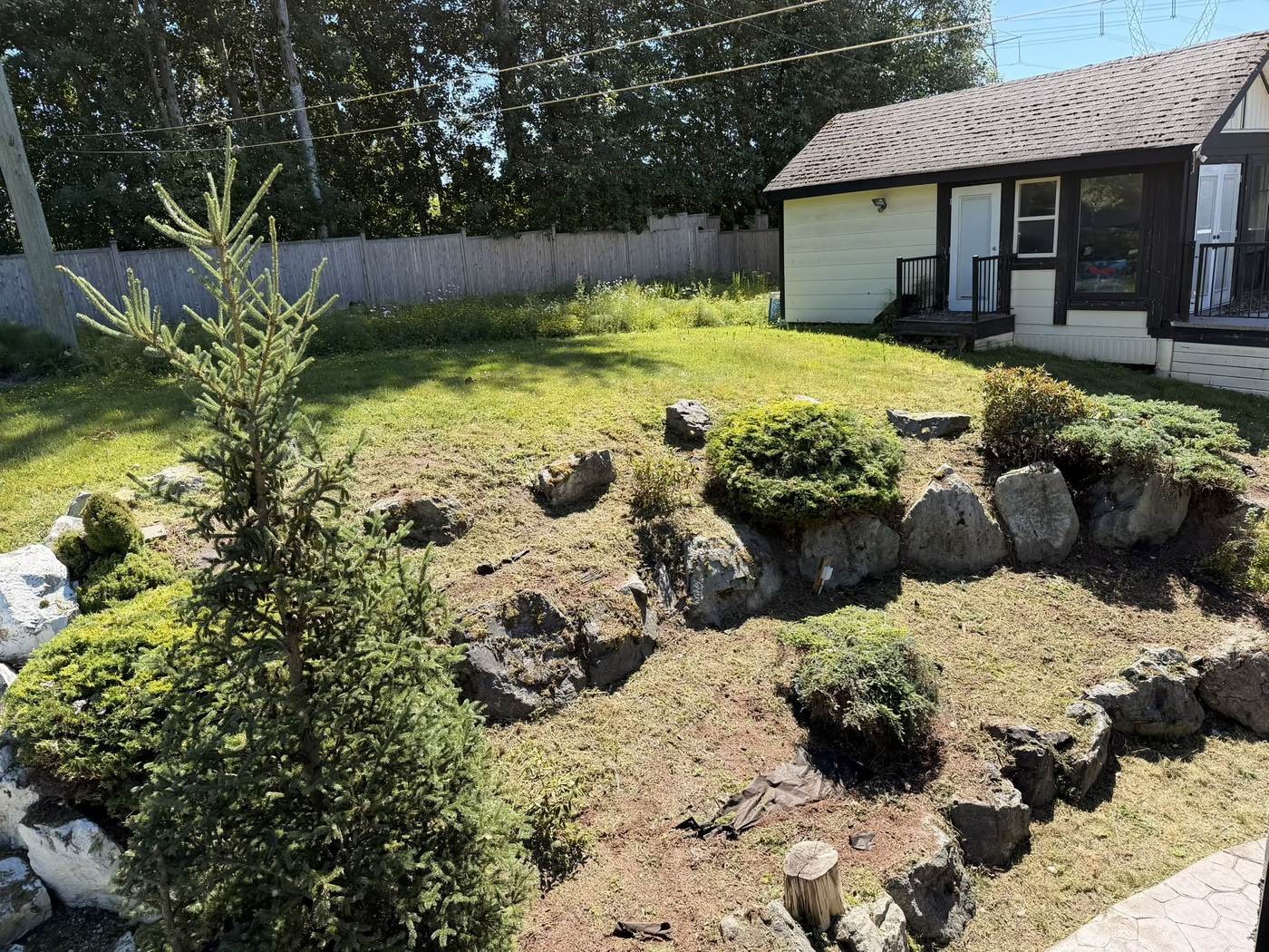 The same rock garden cleared with the stone beds exposed