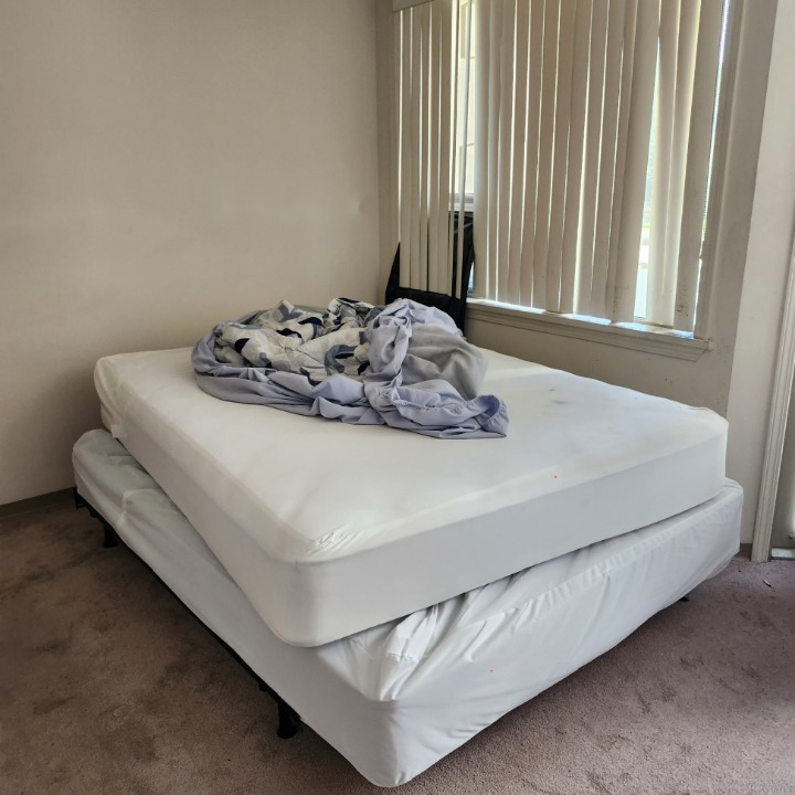 Mattress, box spring and bedding ready for removal